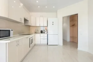 A sleek and modern built-in microwave oven installed in a contemporary kitchen.