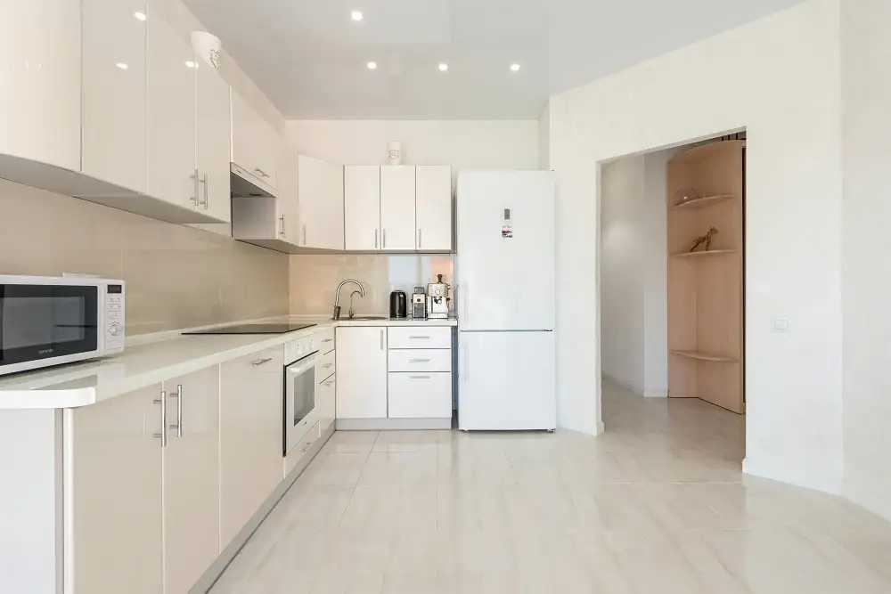 A sleek and modern built-in microwave oven installed in a contemporary kitchen.